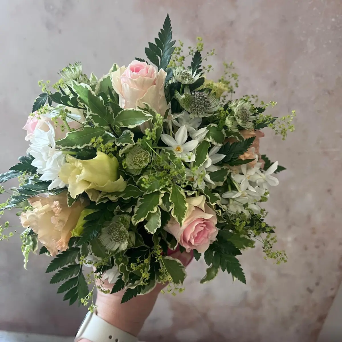 Close-up of seasonal foliage and blooms gathered by Moo's Flowers