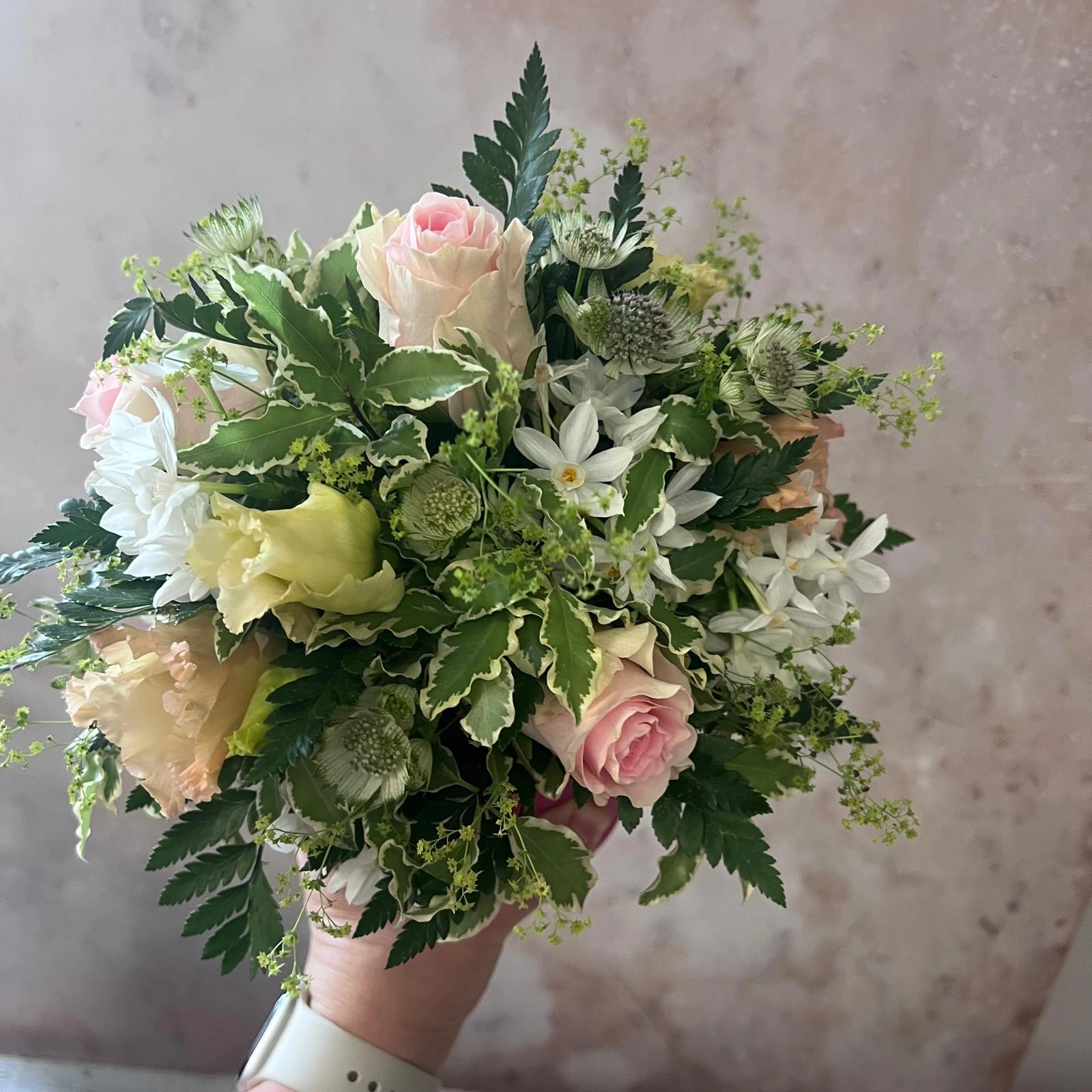 Soft hand-tied posy with seasonal pastel blooms by Moo's Flowers